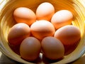 Chicken eggs in bamboo basket. Royalty Free Stock Photo