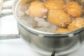 Chicken eggs boil in water. Pan with the product on a gas stove. Royalty Free Stock Photo