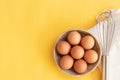 Chicken eggs, brown eggs, broken egg in carton box on yellow background. Top view natural eggs in carton box product concept Royalty Free Stock Photo