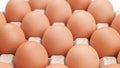 Chicken eggs in carton box on wooden table Royalty Free Stock Photo