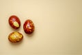 Chicken eggs colored with old-fashioned natural method by onion husks isolated on light brown. Topview of brown eggs with