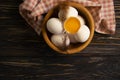 Chicken eggs, feather product on wooden background farm Royalty Free Stock Photo