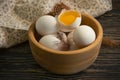 Chicken eggs, feather diet product on wooden background farm Royalty Free Stock Photo