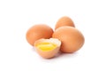 Chicken eggs and half broken egg with yolk isolated Royalty Free Stock Photo