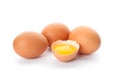 Chicken eggs and half broken egg with yolk isolated Royalty Free Stock Photo