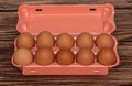 Chicken eggs in a package. On a brown background. Natural product Royalty Free Stock Photo