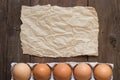 Chicken eggs in the package and paper Royalty Free Stock Photo