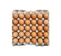 Chicken eggs in paper tray isolated on white background without shadow.Top view of 30 eggs in close-up Royalty Free Stock Photo