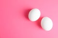 Chicken eggs on pink background Royalty Free Stock Photo