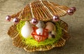 Chicken eggs and quail eggs Guinea fowl egg lie together like pearls in a shell on a wooden table