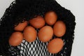 Chicken eggs in a reusable bag. For the presentation of a fragile product. For the presentation of a careful attitude to goods and