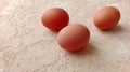 Chicken eggs on spotted textured background