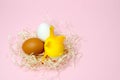 Chicken eggs and toy chicken on pink background. Easter concept. Top view Royalty Free Stock Photo