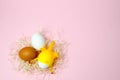 Chicken eggs and toy chicken on pink background. Easter concept. Top view Royalty Free Stock Photo