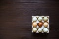 Chicken eggs in tray on wooden table. Nine eggs Royalty Free Stock Photo