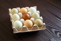 Chicken eggs in tray on wooden table. Nine eggs Royalty Free Stock Photo