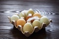 Chicken eggs in tray on wooden table. Nine eggs Royalty Free Stock Photo