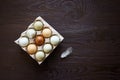 Chicken eggs in tray on wooden table. Nine eggs Royalty Free Stock Photo