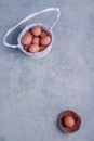 Chicken eggs in white basket. Easter concept