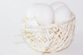 Chicken eggs in a white basket on a white background Royalty Free Stock Photo