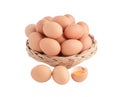 Chicken eggs in the wicker basket and one egg broken Royalty Free Stock Photo