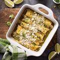 Chicken enchiladas in a casserole dish