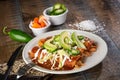 Chicken enchiladas on plate