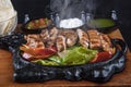 Chicken Fajita: An delicious chicken fajita dish with vegetables. Mexican Food, Mexican chicken fajita in cast iron skillet with Royalty Free Stock Photo