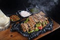 Chicken Fajita: An delicious chicken fajita dish with vegetables. Mexican Food, Mexican chicken fajita in cast iron skillet with Royalty Free Stock Photo