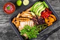 Chicken Fajita Platter with Avocado, Pita Bread, Bell Pepper, Lime, Red Onion and Cilantro, bowl with salsa sauce, clos