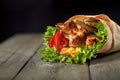 Chicken fajita wrap sandwich. Sandwich with fajita chicken. Roll with chicken meat fresh tomatoes and cucumbers, lettuce Royalty Free Stock Photo