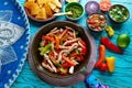 Chicken fajitas in a pan chili and sides Mexican Royalty Free Stock Photo