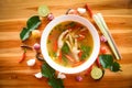 Chicken Feet Spicy Soup / Chicken Foot with hot and sour soup bowl with fresh vegetables Tom Yum thai herbs and spices ingredients Royalty Free Stock Photo