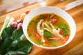 Chicken Feet Spicy Soup / Chicken Foot with hot and sour soup bowl with fresh vegetables Tom Yum thai herbs and spices ingredients Royalty Free Stock Photo