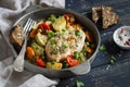 Chicken fillet baked with vegetables in a vintage scourage Royalty Free Stock Photo