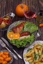 Chicken fillet in a crisp, French fries and a wine glass