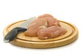 Chicken fillet and knife on hardboard Royalty Free Stock Photo