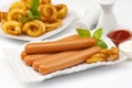 Chicken franks with potato swirls basil and ketchup with mayonnaise Royalty Free Stock Photo