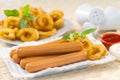 Chicken franks with potato swirls basil and ketchup with mayonnaise Royalty Free Stock Photo