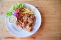 Chicken fried steak with country gravy and french fries. Pork chop, French fries and vegetables. Royalty Free Stock Photo