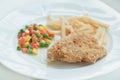 A chicken fried steak with french fries and vegetables Royalty Free Stock Photo