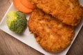 Chicken fried steak with vegetables, pancakes with garlic and herbs