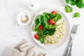 Chicken galantine. Stuffed meat, meatloaf with broccoli, green peas and fresh spinach salad with tomatoes, top view Royalty Free Stock Photo