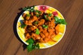 Chicken gizzard stew in plate on rustic wooden table Royalty Free Stock Photo