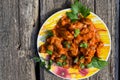 Chicken gizzard stew in plate on wooden table Royalty Free Stock Photo