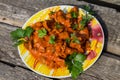 Chicken gizzard stew in plate on wooden table Royalty Free Stock Photo