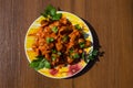 Chicken gizzard stew in plate on wooden table Royalty Free Stock Photo
