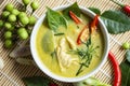 Chicken green curry Thai food on soup bowl with ingredient vegetable herbs and spices pepper chili, Traditional green curry Royalty Free Stock Photo