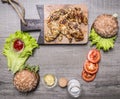 chicken grilled with mustard sauce with ingredients for homemade burger, vegetables and spices place text,frame on wooden rust