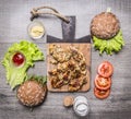 Chicken grilled with mustard sauce with ingredients for homemade burger, vegetables and spices wooden rustic background top vie